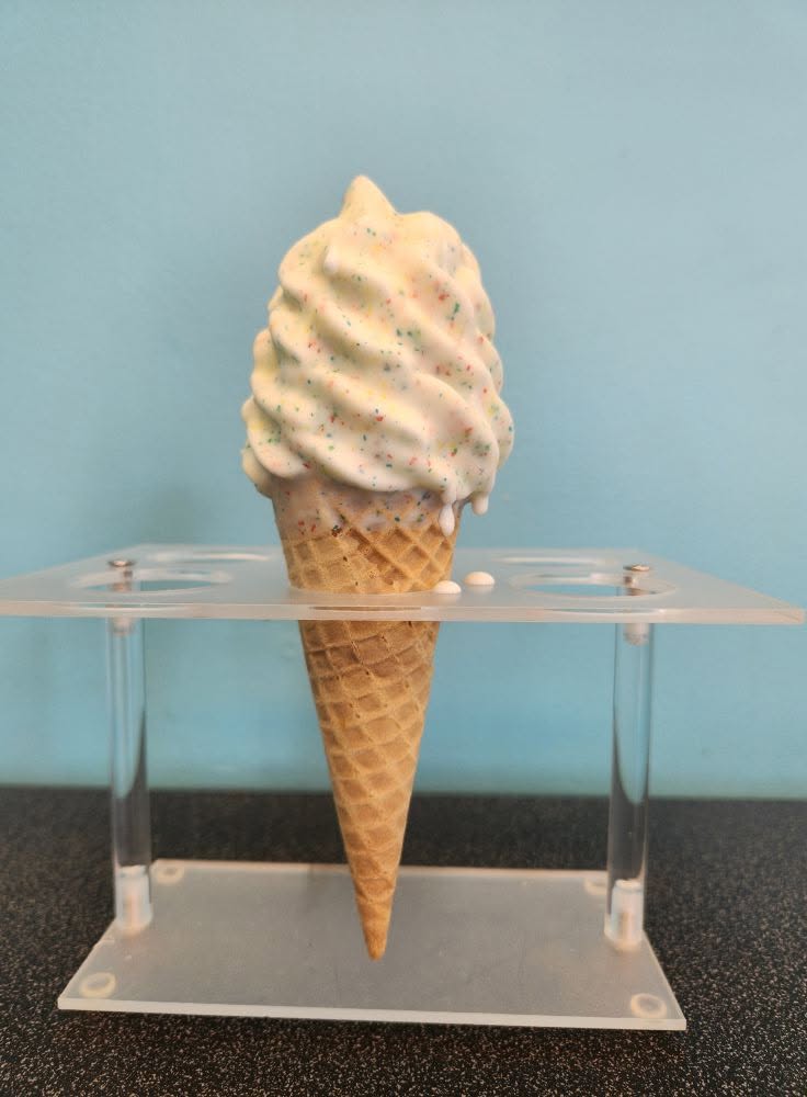 Soft serve cone with rainbow sprinkles